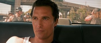 Movie still from “The Lincoln Lawyer” (2011), directed by Brad Furman – A person sitting in a car; Close Up shot, Over the shoulder angle