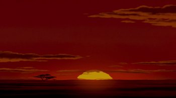 Movie still from “The Lion King” (1994), directed by Rob Minkoff – An image of an african sunset in the distance; Extreme Wide shot, Low angle