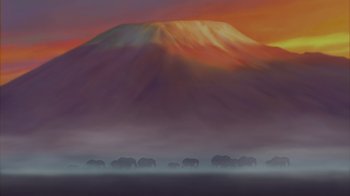 Movie still from “The Lion King” (1994), directed by Rob Minkoff – A herd of elephants walking across a grass covered field; Extreme Wide shot, Low angle