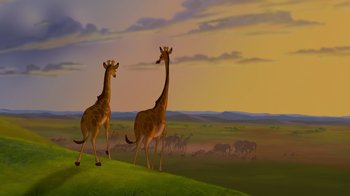 Movie still from “The Lion King” (1994), directed by Rob Minkoff – Two giraffes standing on top of a green hill; Wide shot, Low angle