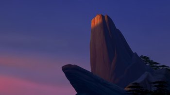 Movie still from “The Lion King” (1994), directed by Rob Minkoff – A rock formation with a sky in the background at sunset; Extreme Wide shot, Low angle