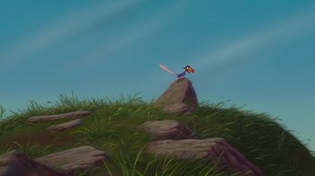 Movie still from “The Lion King” (1994), directed by Rob Minkoff – A painting of a bird sitting on top of a rock; Extreme Wide shot, Low angle