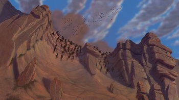 Movie still from “The Lion King” (1994), directed by Rob Minkoff – A painting of a mountain with a flock of birds flying over it; Extreme Wide shot, High angle