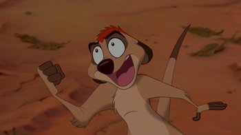 Movie still from “The Lion King” (1994), directed by Rob Minkoff – An animated dog with a red mohawk standing in the sand; Close Up shot, Low angle