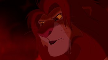 Movie still from “The Lion King” (1994), directed by Rob Minkoff – A lion's face in the dark; Close Up shot, Low angle