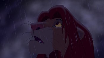 Movie still from “The Lion King” (1994), directed by Rob Minkoff – The face of a lion in the rain; Close Up shot, Low angle