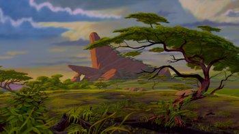 Movie still from “The Lion King” (1994), directed by Rob Minkoff – A painting of a large rock formation in the middle of a lush green field; Extreme Wide shot, Low angle