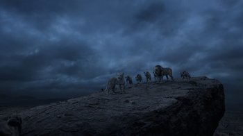 Movie still from “The Lion King” (2019), directed by Jon Favreau – A group of lions standing on top of a hill; Extreme Wide shot, Low angle