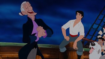 Movie still from “The Little Mermaid” (1989), directed by John Musker – A man and an old man are sitting next to each other in front of a sky background; Medium shot, Over the shoulder angle