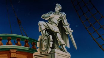 Movie still from “The Little Mermaid” (1989), directed by John Musker – A statue of a man holding a sword; Wide shot, Low angle