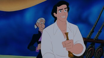 Movie still from “The Little Mermaid” (1989), directed by John Musker – An old man and a young man are in a cartoon; Medium shot, Over the shoulder angle