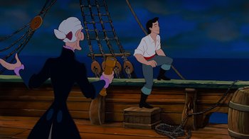 Movie still from “The Little Mermaid” (1989), directed by John Musker – An animated scene of a man on a boat with an old woman; Medium shot, Low angle