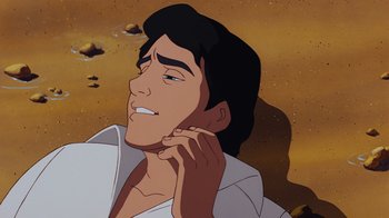 Movie still from “The Little Mermaid” (1989), directed by John Musker – A cartoon of a man with a white shirt and black hair; Close Up shot, Low angle