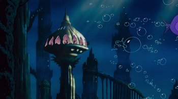 Movie still from “The Little Mermaid” (1989), directed by John Musker – An image of an underwater city at night time; Extreme Wide shot, High angle