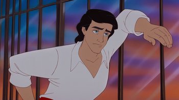 Movie still from “The Little Mermaid” (1989), directed by John Musker – A man in a white shirt and red pants; Medium shot, Low angle