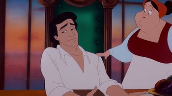 Movie still from “The Little Mermaid” (1989), directed by John Musker – A man sitting in front of a mirror with his hand on his shoulder; Medium shot, Over the shoulder angle