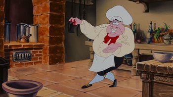 Movie still from “The Little Mermaid” (1989), directed by John Musker – A cartoon of a man dressed as a chef pointing; Medium shot, Low angle
