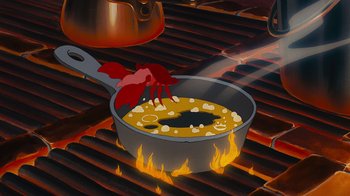Movie still from “The Little Mermaid” (1989), directed by John Musker – An illustration of a pan of food cooking on a grill; Extreme Close Up shot, Overhead angle