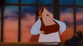 Movie still from “The Little Mermaid” (1989), directed by John Musker – A woman standing in front of a window with a plate in front of her; Medium shot, Low angle