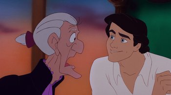 Movie still from “The Little Mermaid” (1989), directed by John Musker – An old man and a young man are looking at one another; Close Up shot, Over the shoulder angle