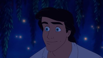 Movie still from “The Little Mermaid” (1989), directed by John Musker – A man that is smiling for the camera; Close Up shot, High angle