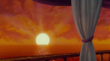 Movie still from “The Little Mermaid” (1989), directed by John Musker – The sun is setting over the ocean as seen from a balcony; Extreme Wide shot, Low angle