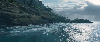 Movie still from “The Little Mermaid” (2023), directed by Rob Marshall – A large body of water near a cliff; Extreme Wide shot, High angle