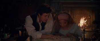Movie still from “The Little Mermaid” (2023), directed by Rob Marshall – A man and a girl looking at a map; Medium shot, High angle