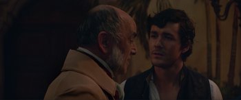 Movie still from “The Little Mermaid” (2023), directed by Rob Marshall – A man and a man talking to each other; Close Up shot, Over the shoulder angle