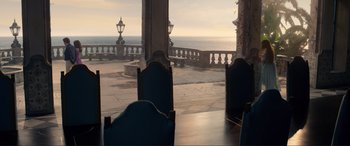 Movie still from “The Little Mermaid” (2023), directed by Rob Marshall – A view of the ocean from a dining room table; Extreme Wide shot, High angle