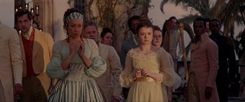 Movie still from “The Little Mermaid” (2023), directed by Rob Marshall – A group of young people standing around each other; Medium shot, High angle