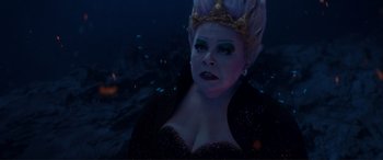 Movie still from “The Little Mermaid” (2023), directed by Rob Marshall – A person wearing a crown; Close Up shot, High angle