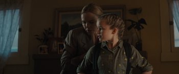 Movie still from “The Locksmith” (2023), directed by Nicolas Harvard – A woman and a girl are looking at each other; Close Up shot, Over the shoulder angle