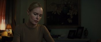 Movie still from “The Locksmith” (2023), directed by Nicolas Harvard – A woman sitting in front of a computer monitor; Close Up shot, Over the shoulder angle