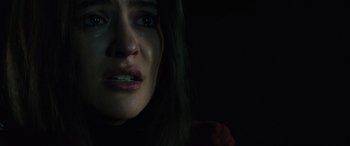 Movie still from “The Locksmith” (2023), directed by Nicolas Harvard – A person with a crying face; Close Up shot, Over the shoulder angle