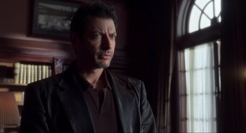 Movie still from “The Lost World: Jurassic Park” (1997), directed by Steven Spielberg – A person wearing a jacket; Close Up shot, Over the shoulder angle