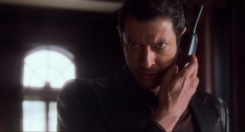 Movie still from “The Lost World: Jurassic Park” (1997), directed by Steven Spielberg – A person talking on a cell phone; Close Up shot, Low angle