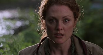 Movie still from “The Lost World: Jurassic Park” (1997), directed by Steven Spielberg – A person wearing a jacket; Close Up shot, Over the shoulder angle