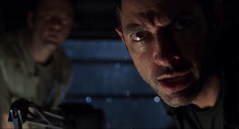 Movie still from “The Lost World: Jurassic Park” (1997), directed by Steven Spielberg – A man's face in the dark; Close Up shot, Low angle
