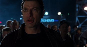 Movie still from “The Lost World: Jurassic Park” (1997), directed by Steven Spielberg – A person in a dark room; Close Up shot, Over the shoulder angle