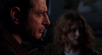 Movie still from “The Lost World: Jurassic Park” (1997), directed by Steven Spielberg – A man and a woman looking at each other in a dark room; Close Up shot, Over the shoulder angle