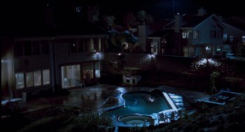 Movie still from “The Lost World: Jurassic Park” (1997), directed by Steven Spielberg – A pool in the middle of the night with lights on; Extreme Wide shot, High angle