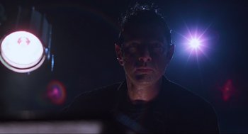 Movie still from “The Lost World: Jurassic Park” (1997), directed by Steven Spielberg – A person looking at the camera; Close Up shot, Low angle