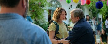 Movie still from “The Machine” (2023), directed by Peter Atencio – A man and a woman holding each others hands; Medium shot, Over the shoulder angle