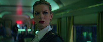 Movie still from “The Machine” (2023), directed by Peter Atencio – A person wearing a jacket; Close Up shot, Low angle