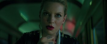 Movie still from “The Machine” (2023), directed by Peter Atencio – A person with tattoos on their hands; Close Up shot, Low angle