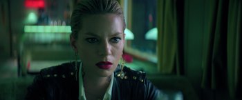 Movie still from “The Machine” (2023), directed by Peter Atencio – A person wearing a leather jacket; Close Up shot, Low angle