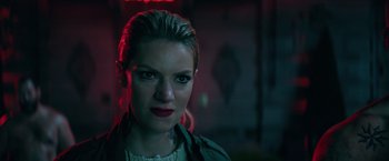 Movie still from “The Machine” (2023), directed by Peter Atencio – A person wearing a jacket; Close Up shot, Low angle