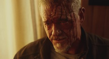 Movie still from “Euphoria” (2019), created by Sam Levinson – An older man with a blood covered face; Close Up shot, Low angle