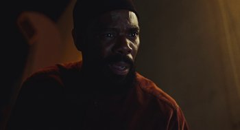 Movie still from “Euphoria” (2019), created by Sam Levinson – A man with a beard is looking at the camera; Close Up shot, Low angle